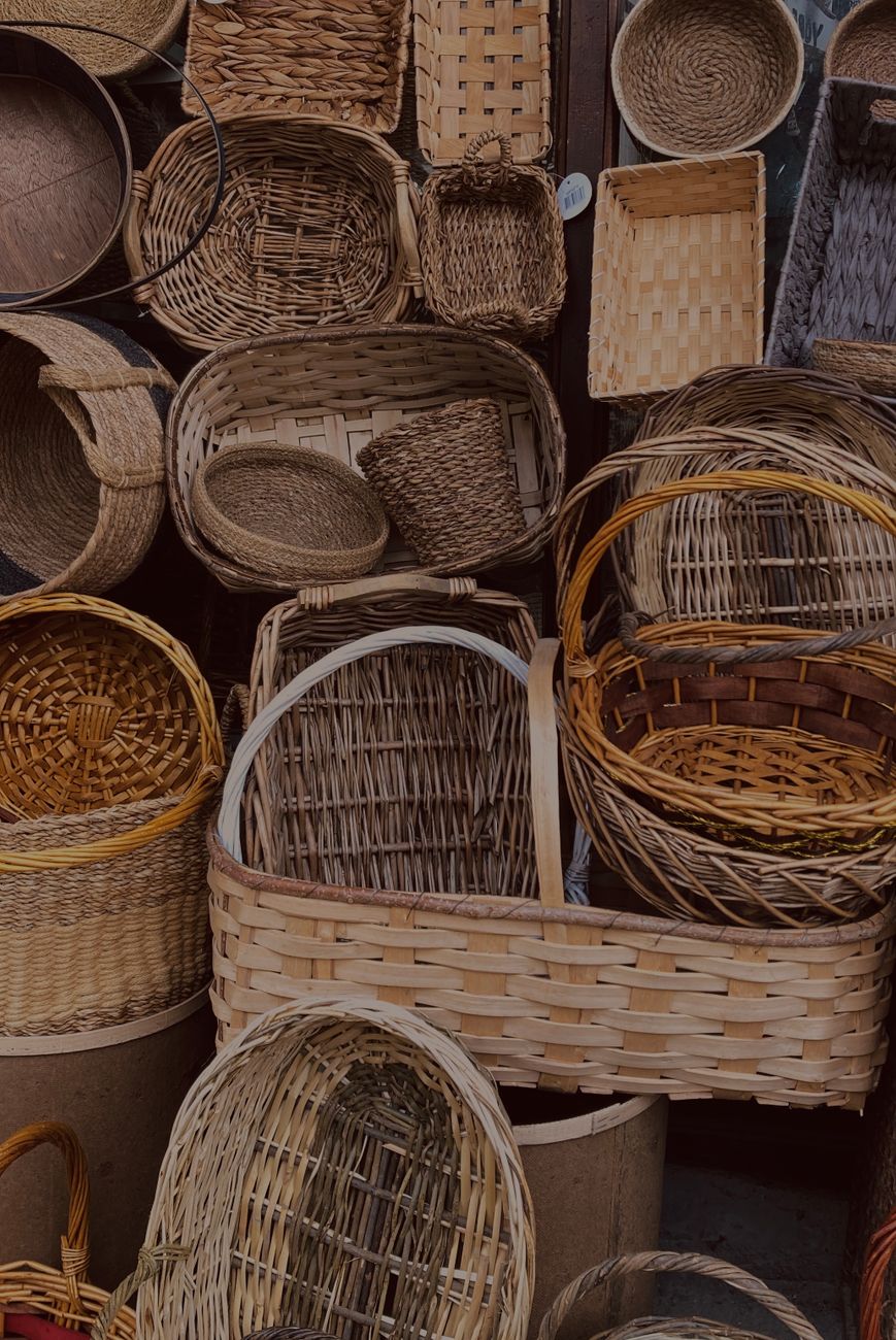Artisanal baskets display on an open market stand
